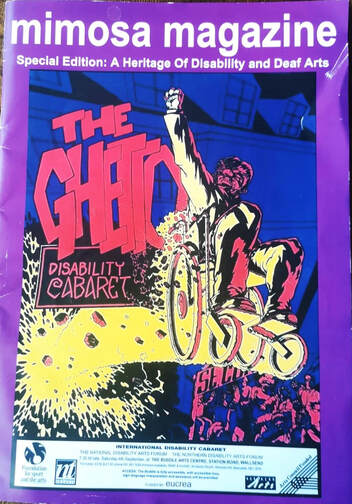A Heritage edition of Mimosa Magazine with a poster for The Ghetto Cabaret on the front. The main colours arev purple, red, blue and yellow. A wheelchair user is bursting defiantly from a wall and has their arm raised with fist clenched as a symbol of power. 