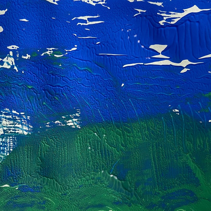 Bright blue and green inks merge in the middle, creating a suggestion of a landscape with white patches in the blue. Bold line markings suggest movement, trees, poles, or grasses. 
