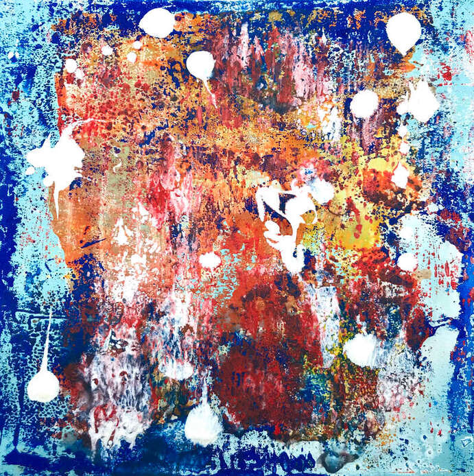 Printmaking involves rolling several layers of coloured inks to create abstract images. This image is predominantly blue background and has bold mixes of orange, dark blue, and hints of red and yellow. Whit ink has been splattered into drops after the print was complete. 