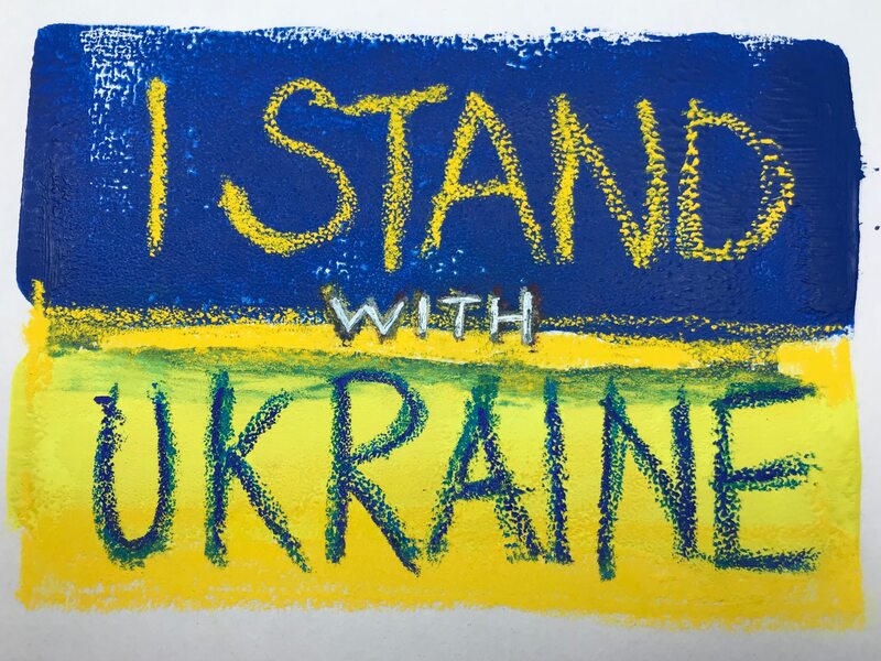 Ink print of the Ukrainian flag with the words 'I stand with Ukraine'. Caroline Cardus