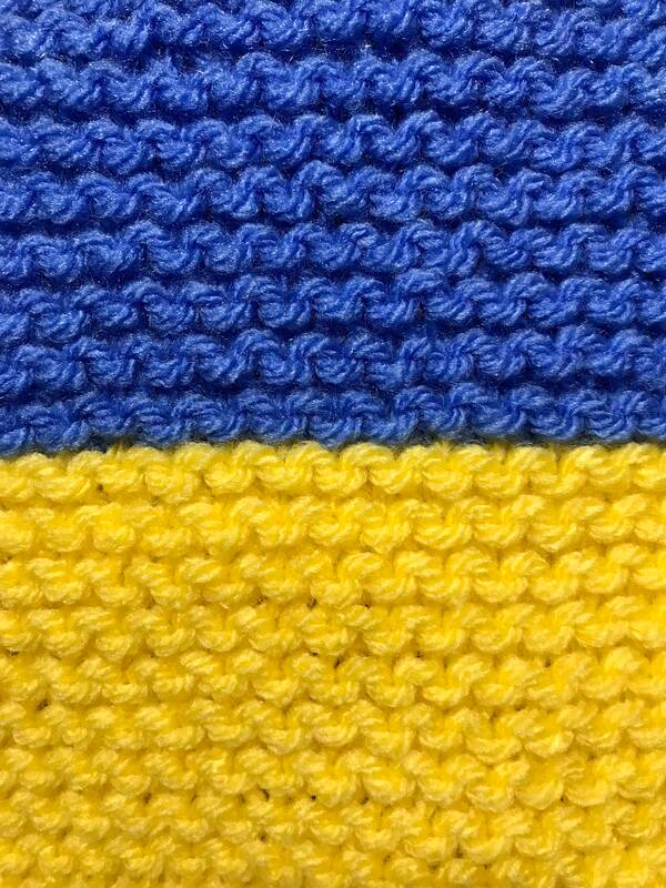 Close up of a knitted Ukrainian flag. Caroline Cardus.
